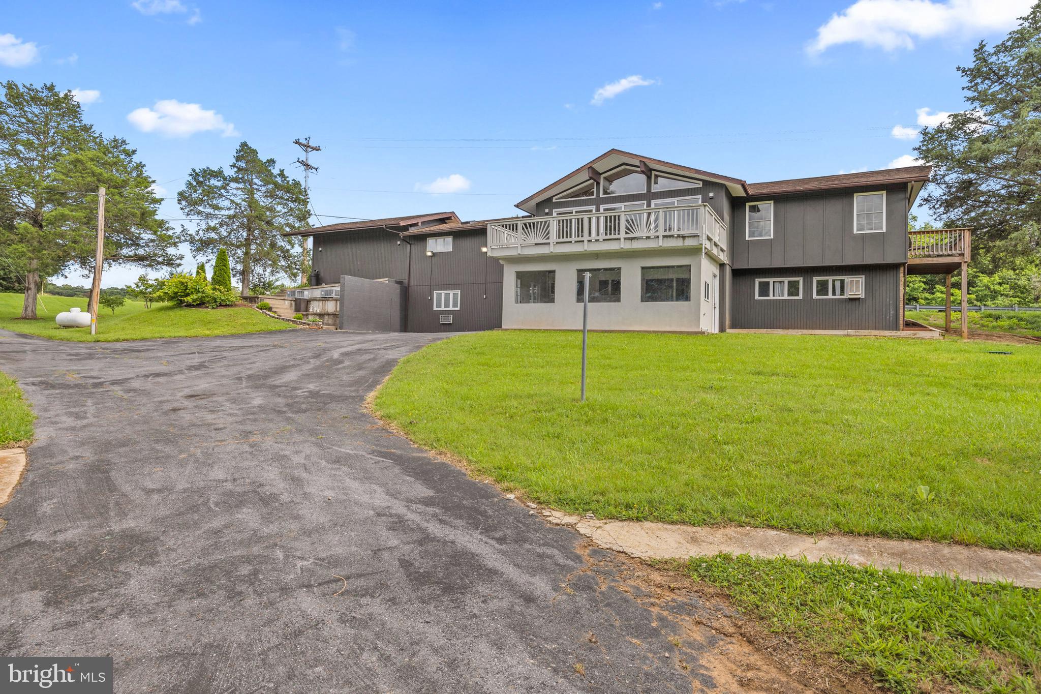 2370 Highway 211 Luray, VA 22835 - Photo 65 of 68 a view of a big house with a big yard and large trees