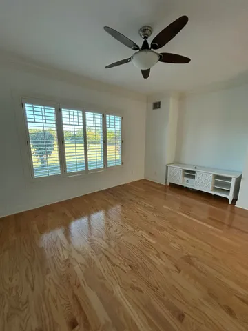 a view of an empty room with a window