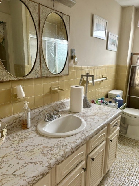 60 N Street Hull, MA 02045 - Photo 29 of 38 a bathroom with a sink and a mirror