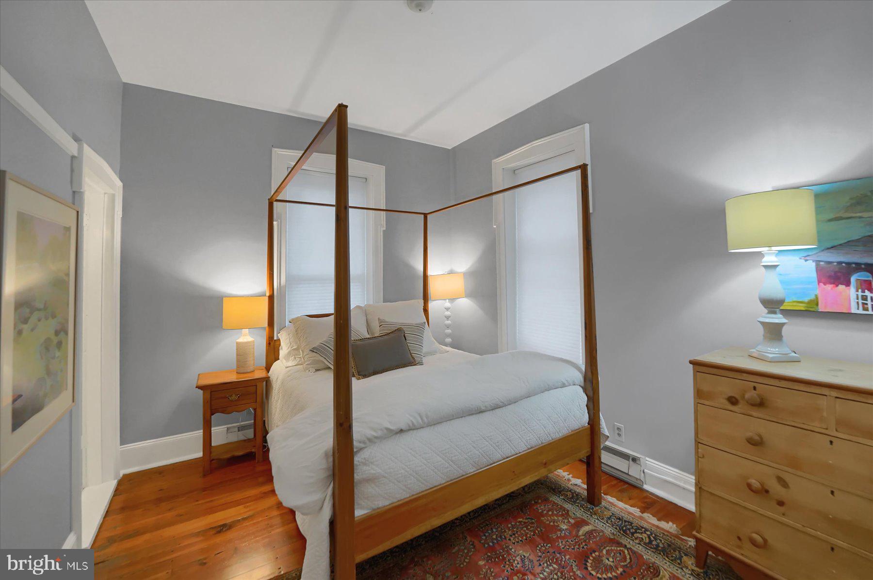 612 Old Rte 322 Spring Mills, PA 16875 - Photo 25 of 79 a bedroom with a bed and a lamp on dresser