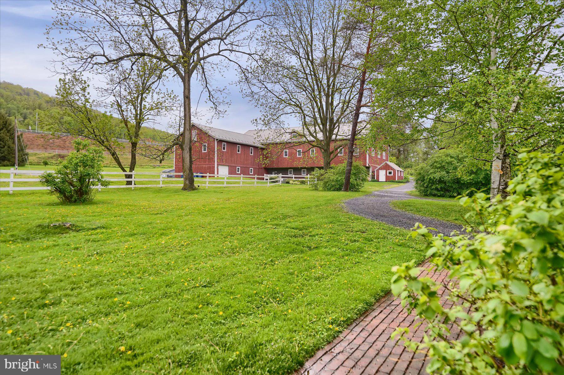 612 Old Rte 322 Spring Mills, PA 16875 - Photo 3 of 79 a backyard of a house with lots of green space and fountain