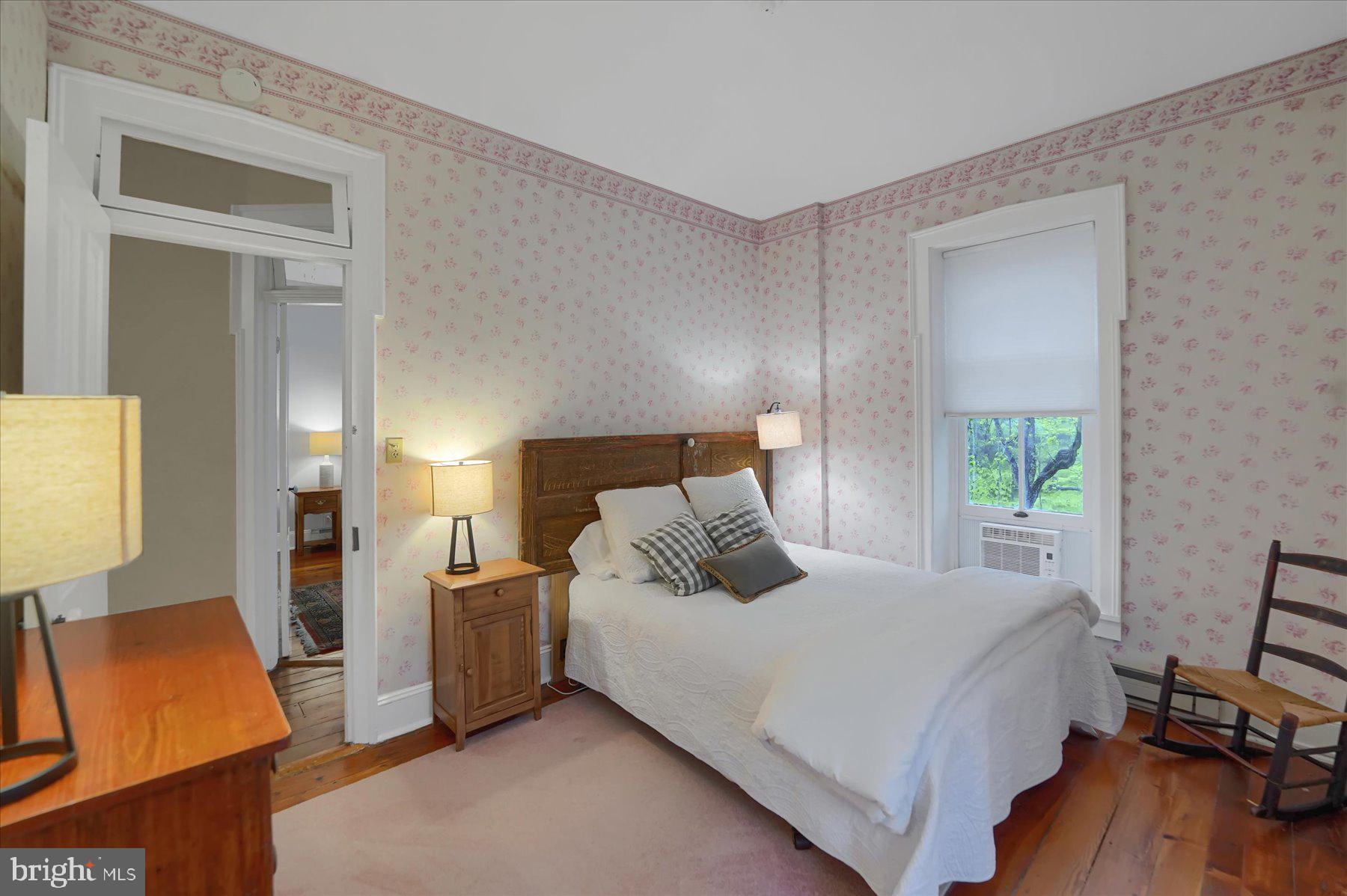 612 Old Rte 322 Spring Mills, PA 16875 - Photo 35 of 79 a bedroom with a bed and wooden floor