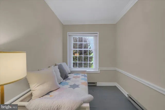 a view of a studio with wooden floor