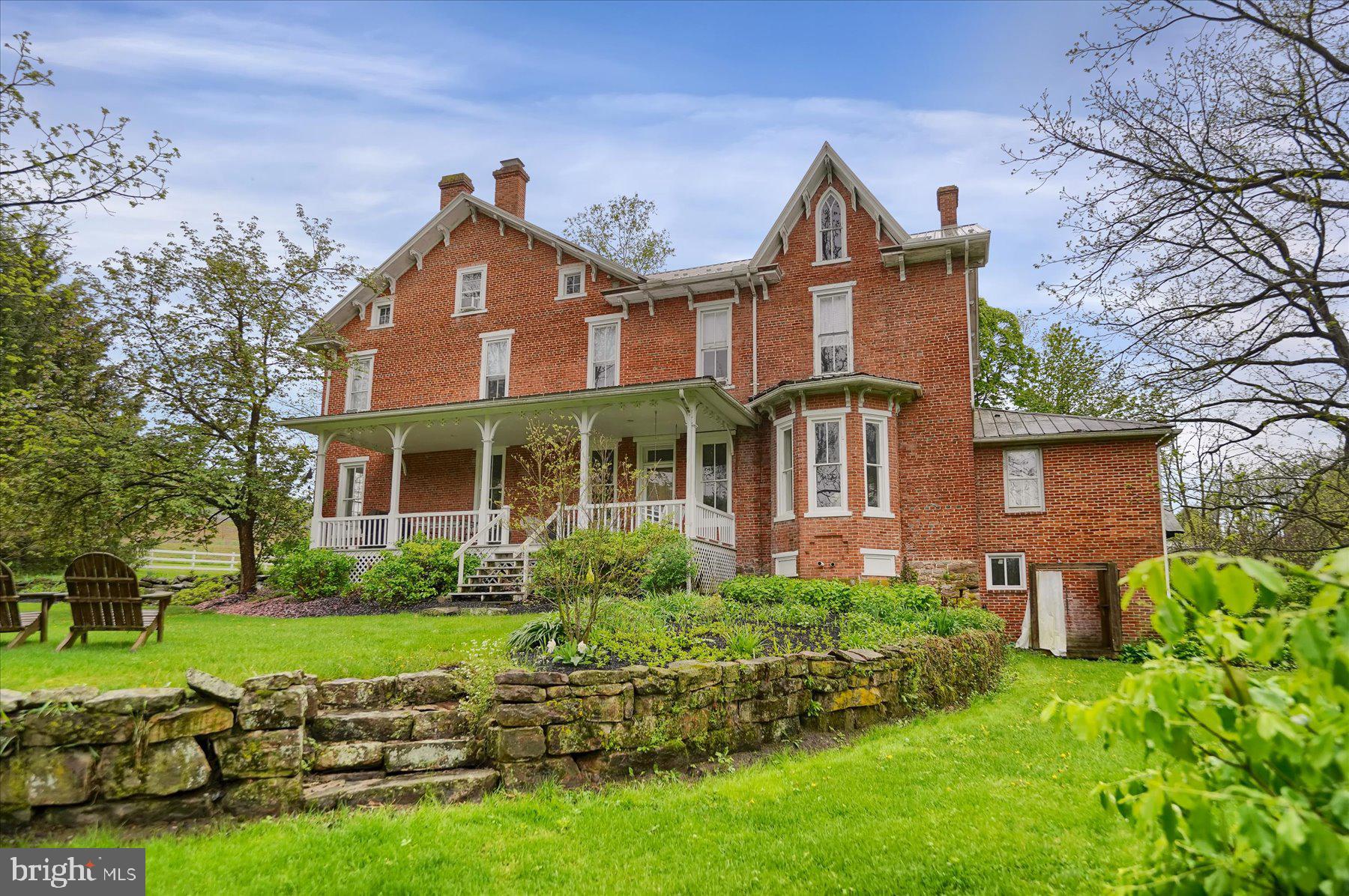 612 Old Rte 322 Spring Mills, PA 16875 - Photo 51 of 79 a front view of a house with garden