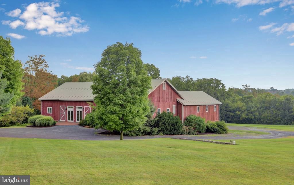 612 Old Rte 322 Spring Mills, PA 16875 - Photo 53 of 79 a front view of a house with a garden and yard