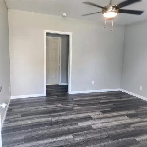 a view of room with wooden floor