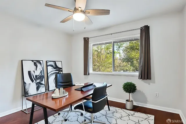 a workspace with furniture and a window