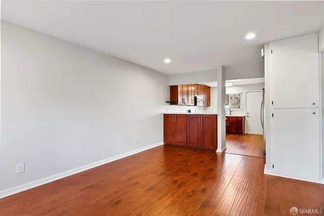 a view of kitchen with wooden floor