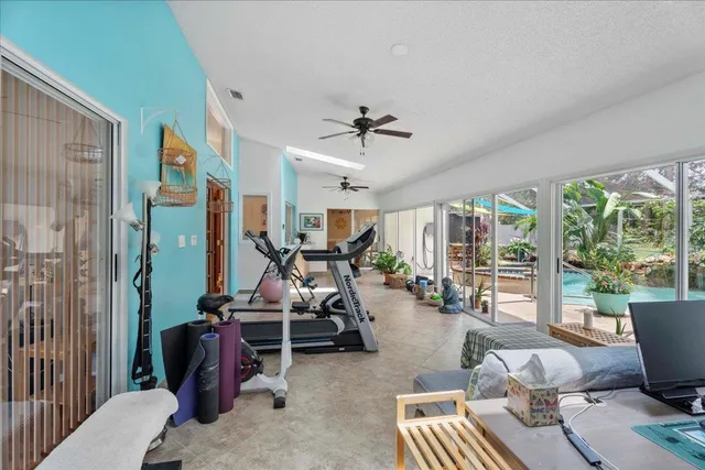 a view of a backyard with plants and a patio