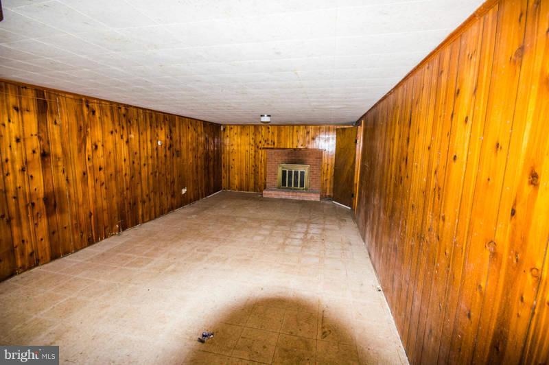 7782 Fort Valley Road Fort Valley, VA 22652 - Photo 13 of 30 a view of a big room with wooden floor and windows