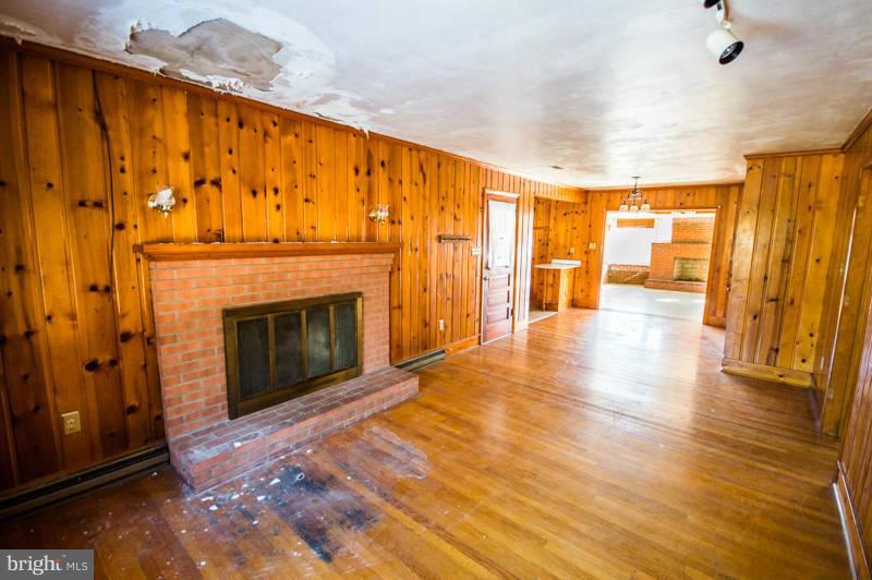 7782 Fort Valley Road Fort Valley, VA 22652 - Photo 16 of 30 a view of an empty room with a fireplace