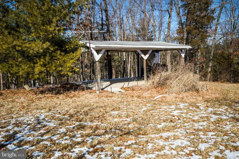 7782 Fort Valley Road Fort Valley, VA 22652 - Photo 5 of 30 a view of a wooden house with a yard