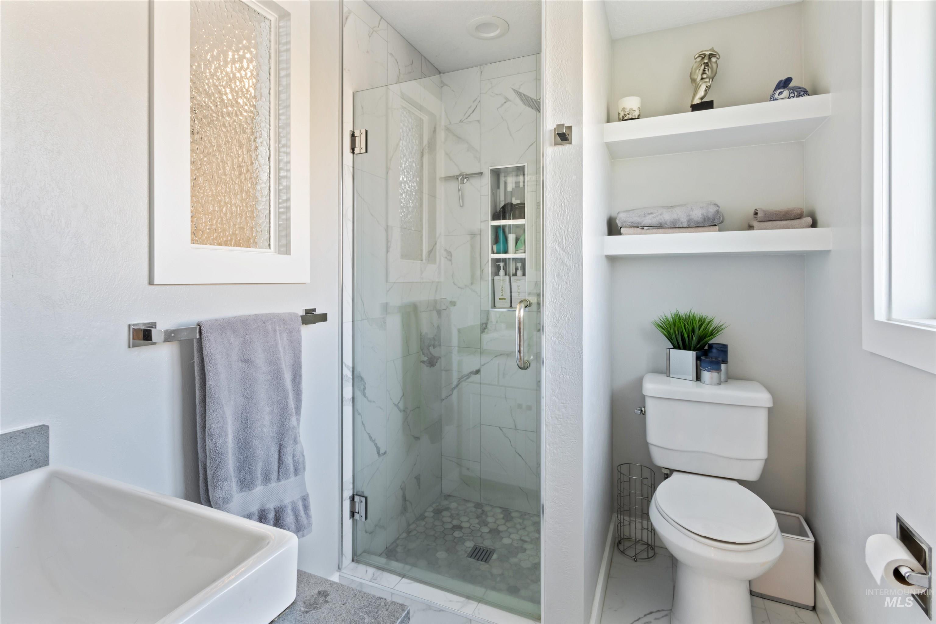 3844 North Patton Street Boise, ID 83704 - Photo 14 of 33 Full bath with toilet and a marble finish shower