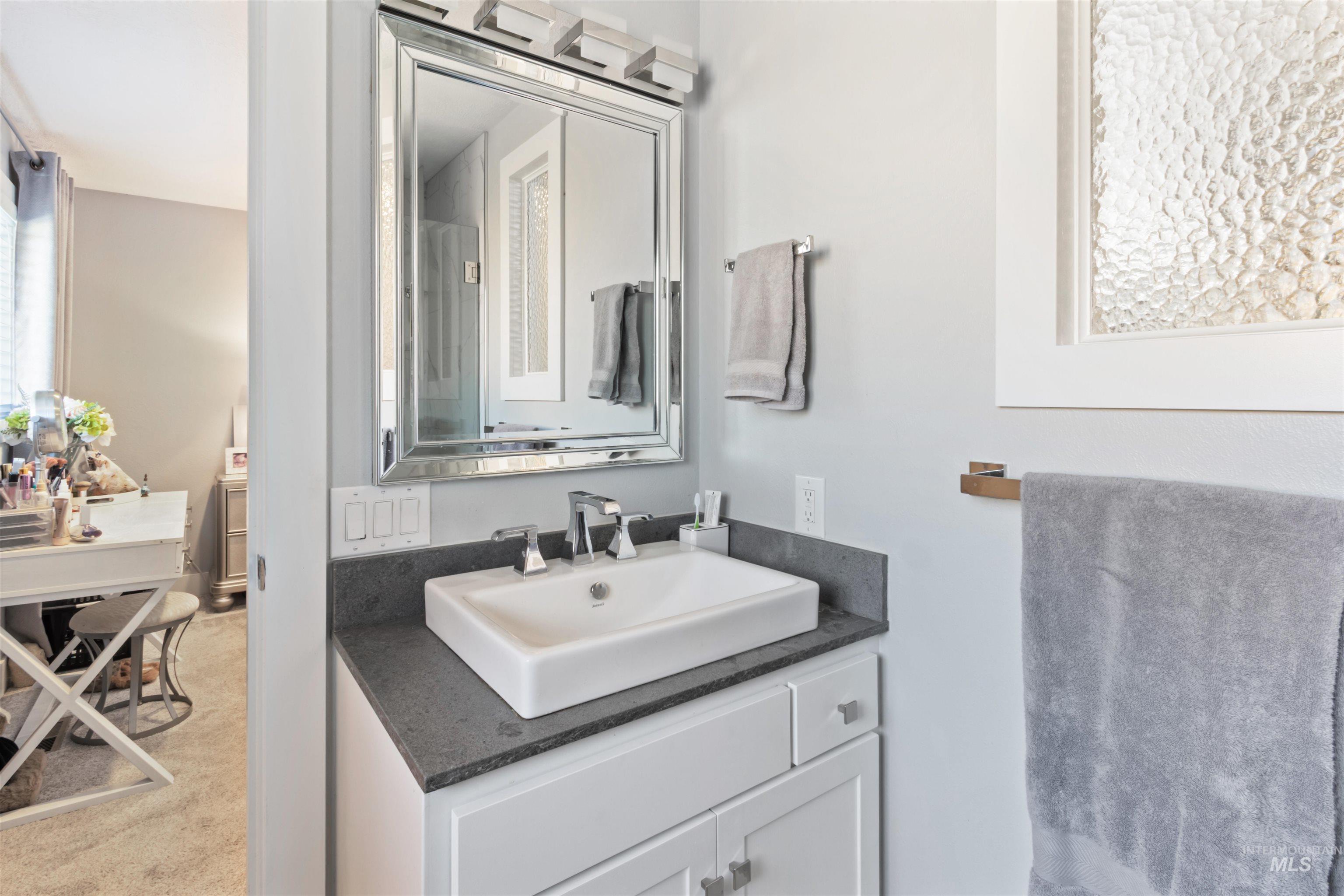 3844 North Patton Street Boise, ID 83704 - Photo 15 of 33 Bathroom with vanity and light carpet