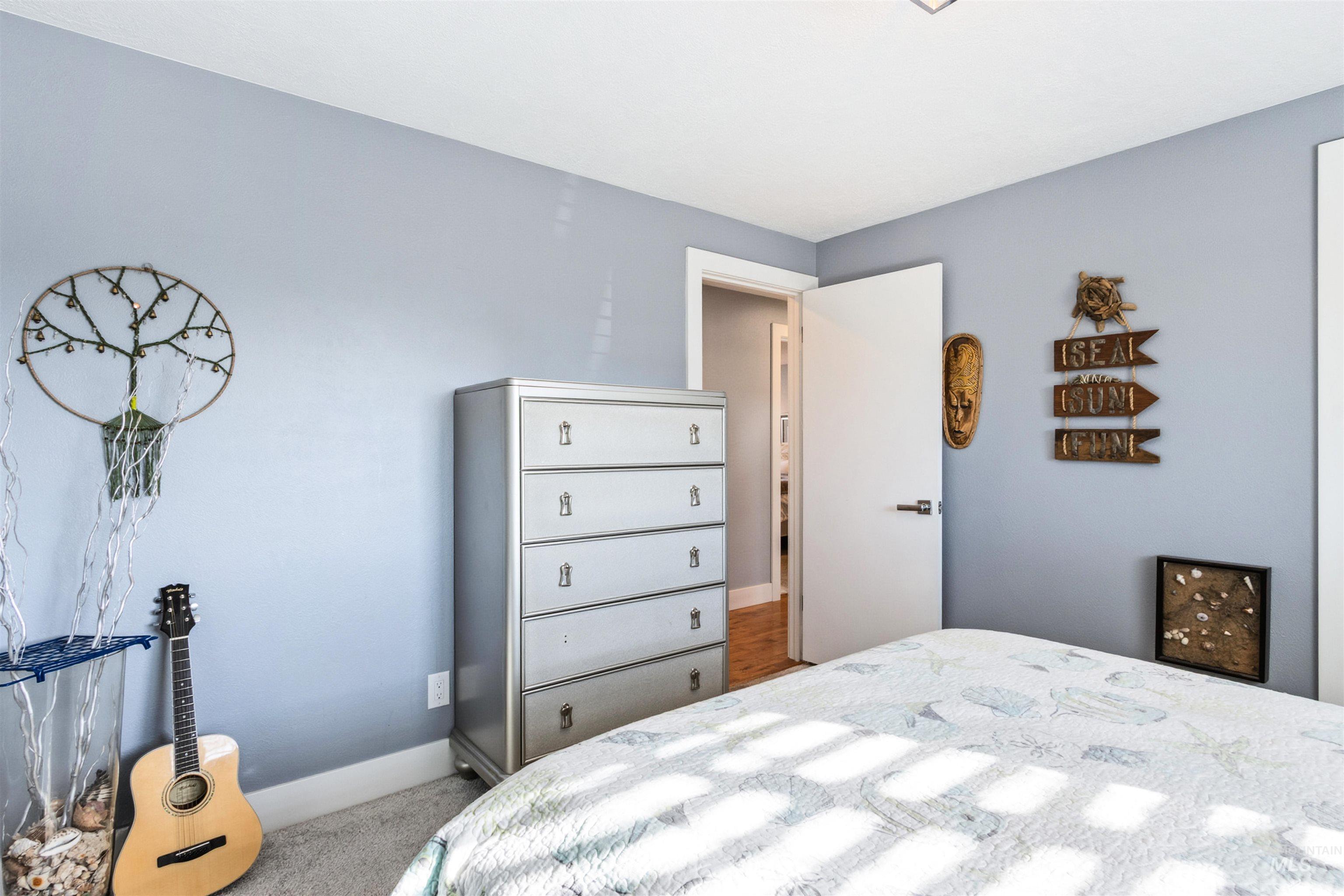 3844 North Patton Street Boise, ID 83704 - Photo 17 of 33 Carpeted bedroom featuring baseboards