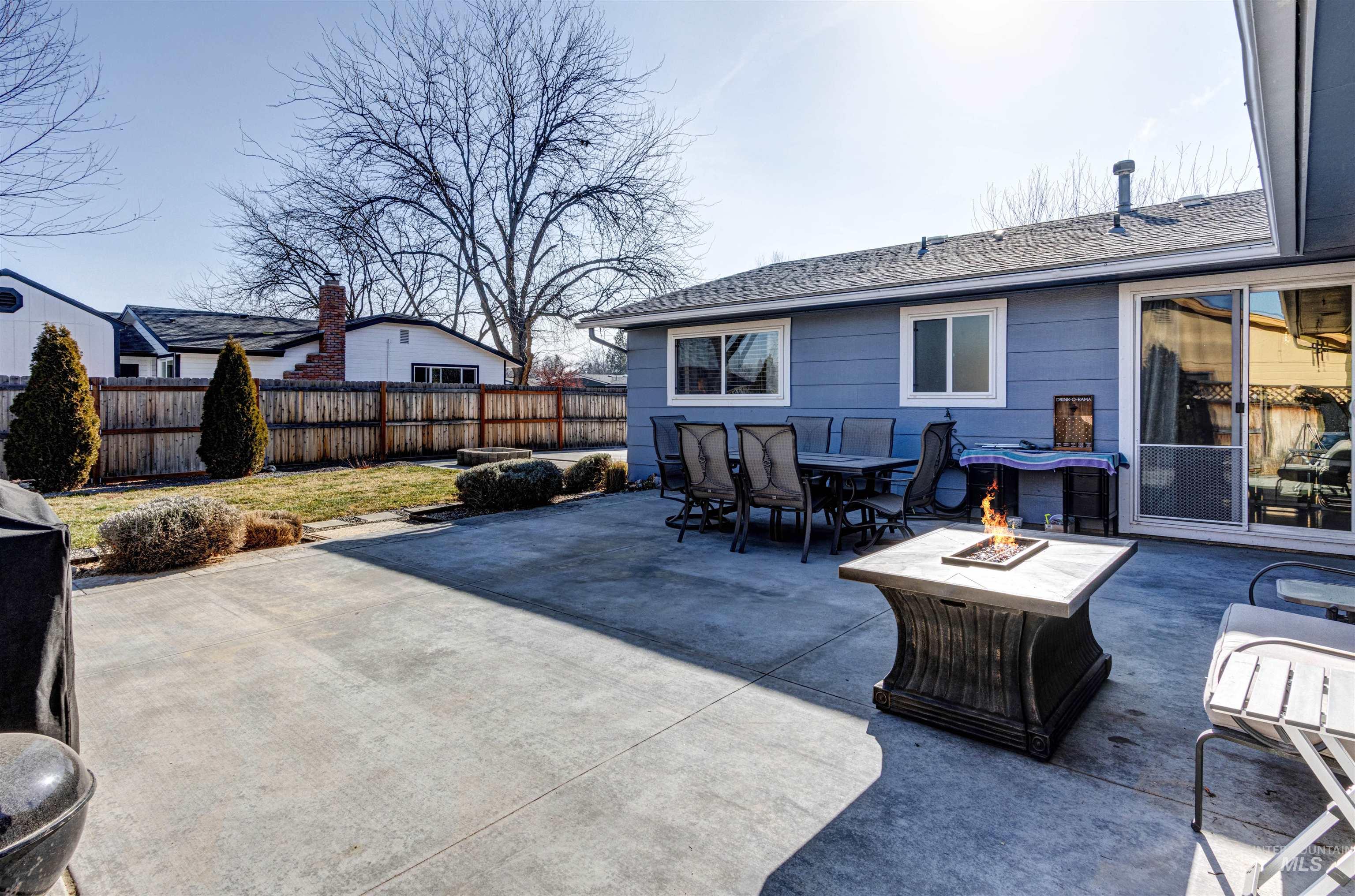 3844 North Patton Street Boise, ID 83704 - Photo 26 of 33 Fenced backyard featuring a patio area, a fire pit, and outdoor dining space