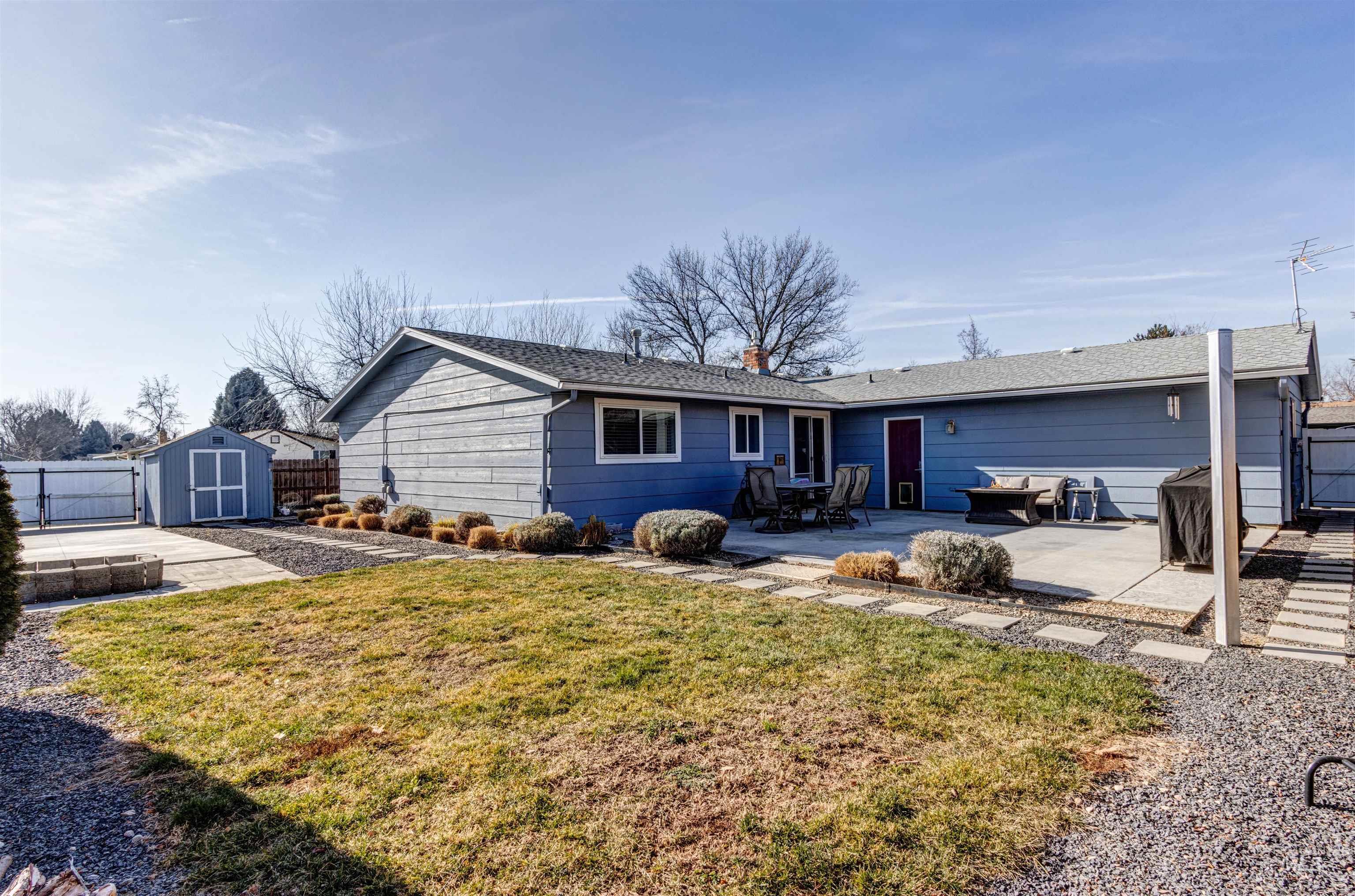 3844 North Patton Street Boise, ID 83704 - Photo 28 of 33 View of front of property with a fenced backyard, a storage unit, a patio area, and a gate