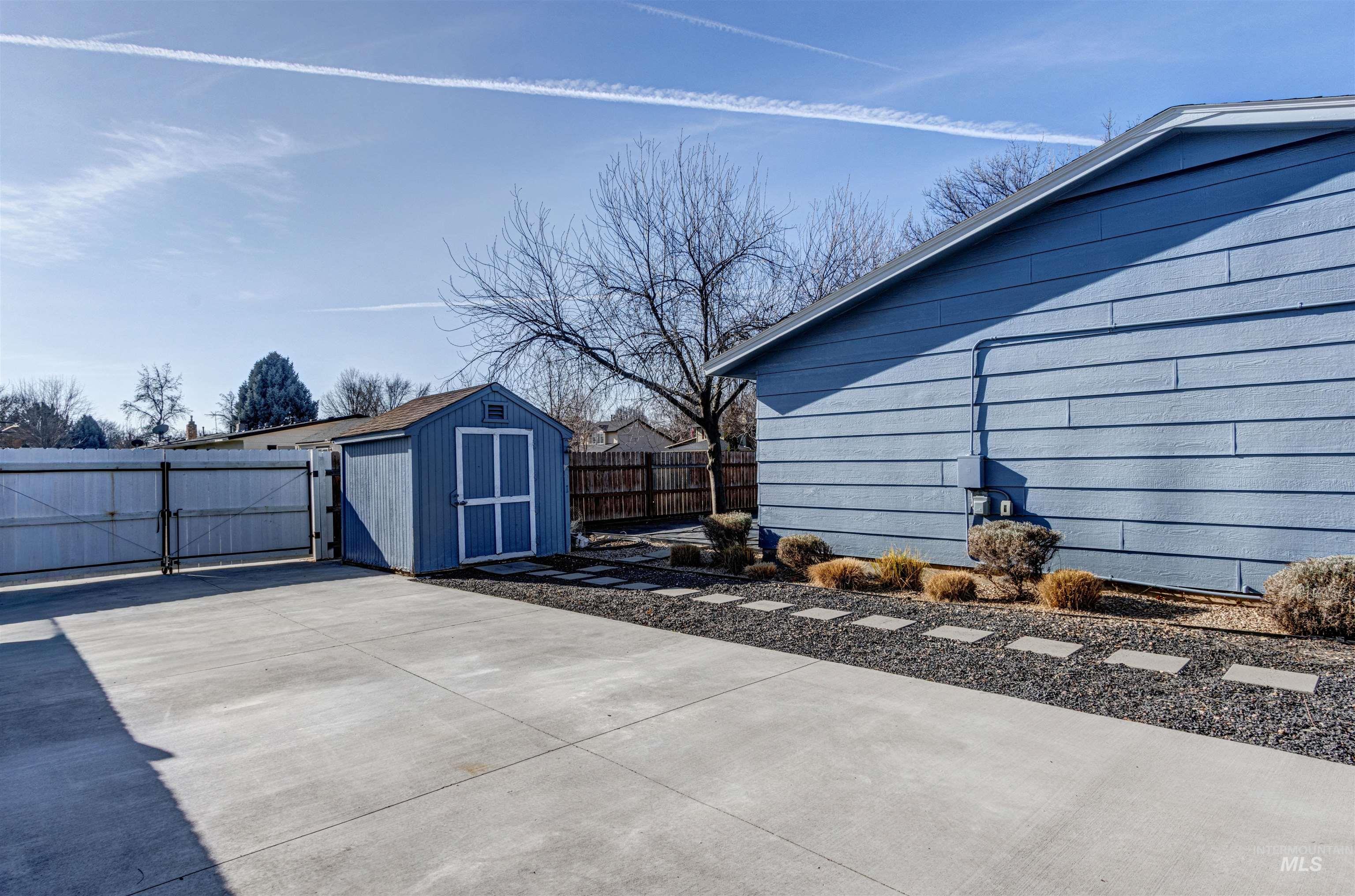 3844 North Patton Street Boise, ID 83704 - Photo 30 of 33 Fenced backyard featuring a storage unit and a gate