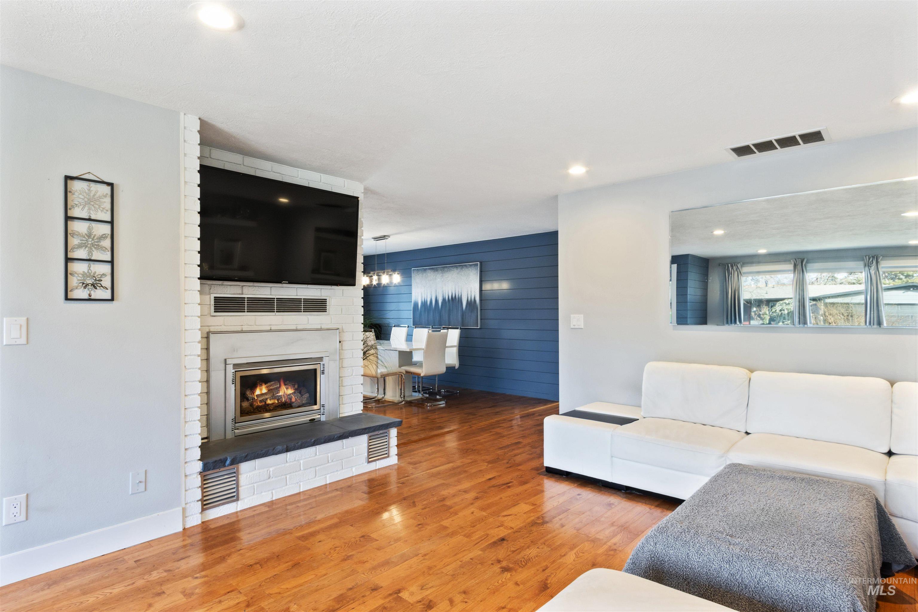 3844 North Patton Street Boise, ID 83704 - Photo 6 of 33 Living room with wood finished floors, recessed lighting, and a fireplace