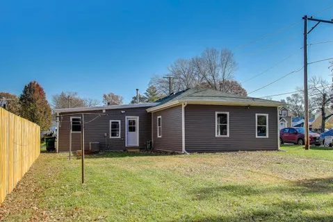 a house that has a tree in front of it