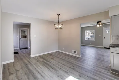 a view of a livingroom with wooden floor