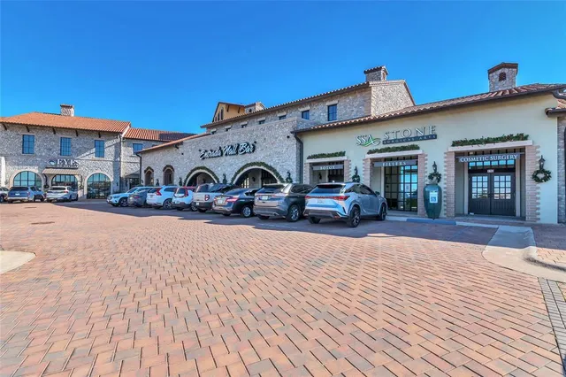 a group of cars parked in front of a building