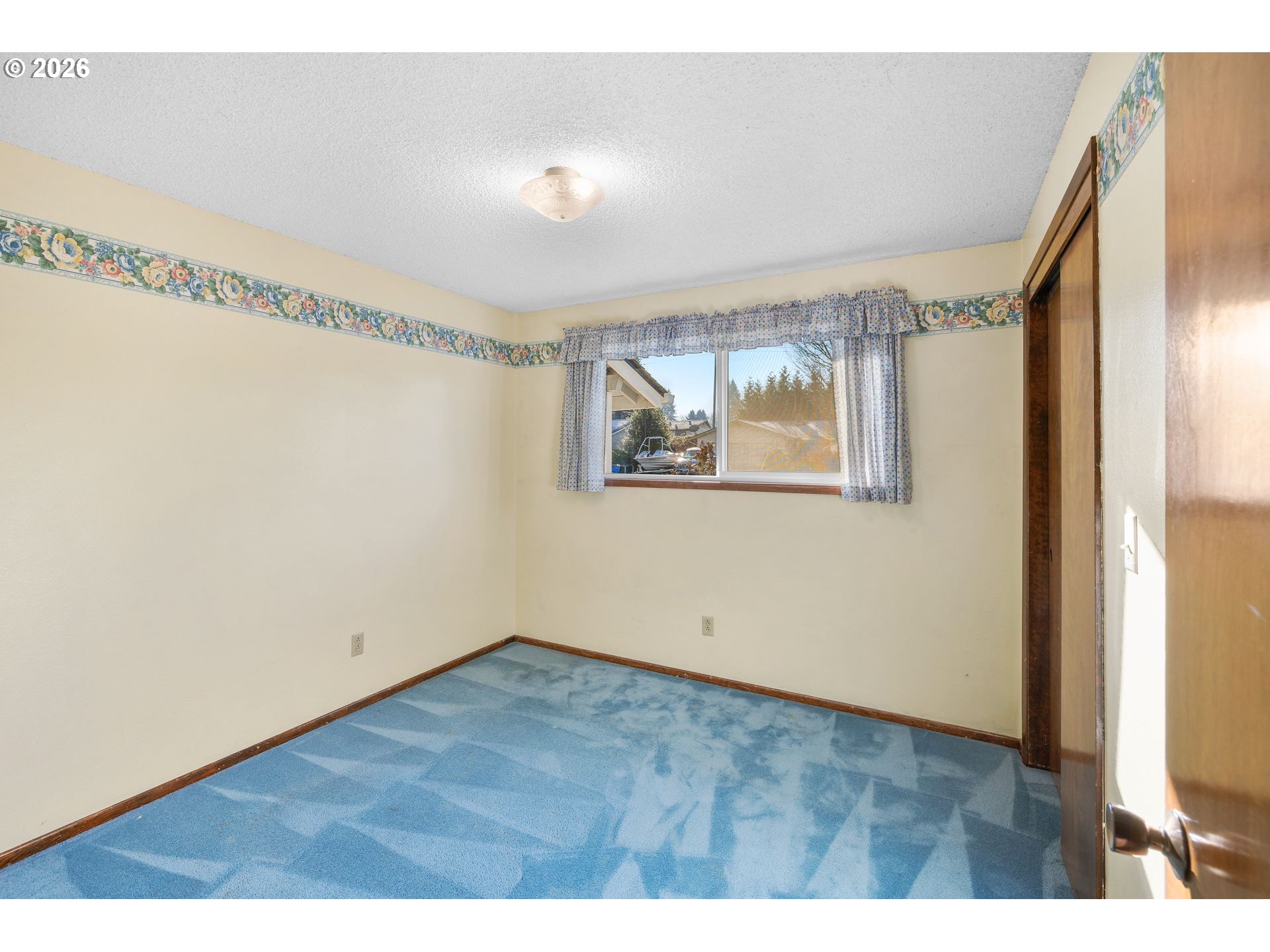 2216 Northeast 91st Street Vancouver, WA 98665 - Photo 16 of 30 a view of an empty room with wooden floor and a window