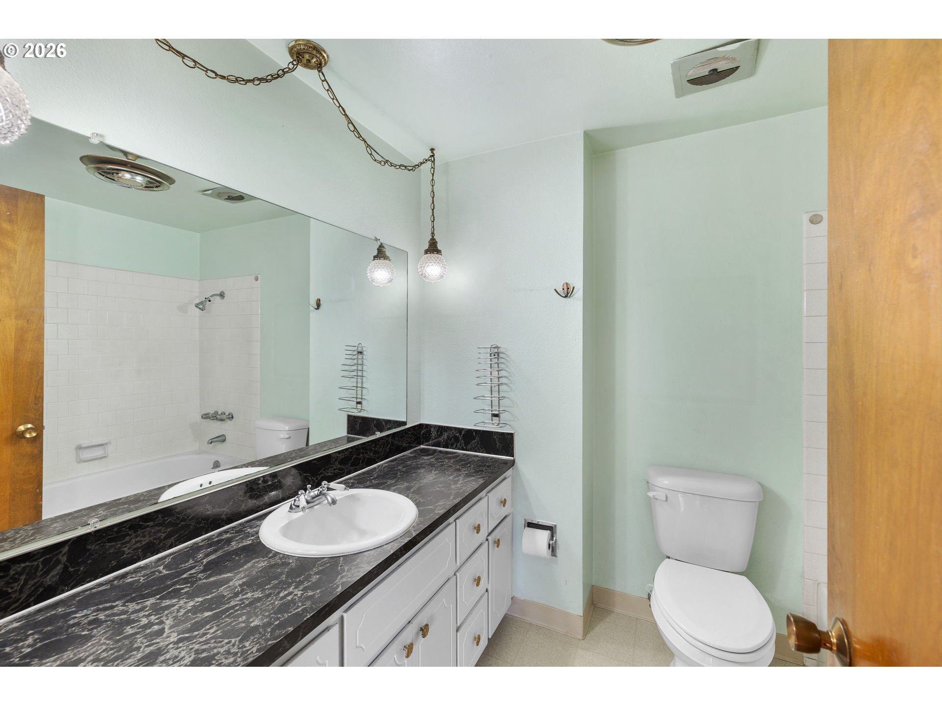 2216 Northeast 91st Street Vancouver, WA 98665 - Photo 18 of 30 a bathroom with a granite countertop sink toilet a mirror and shower