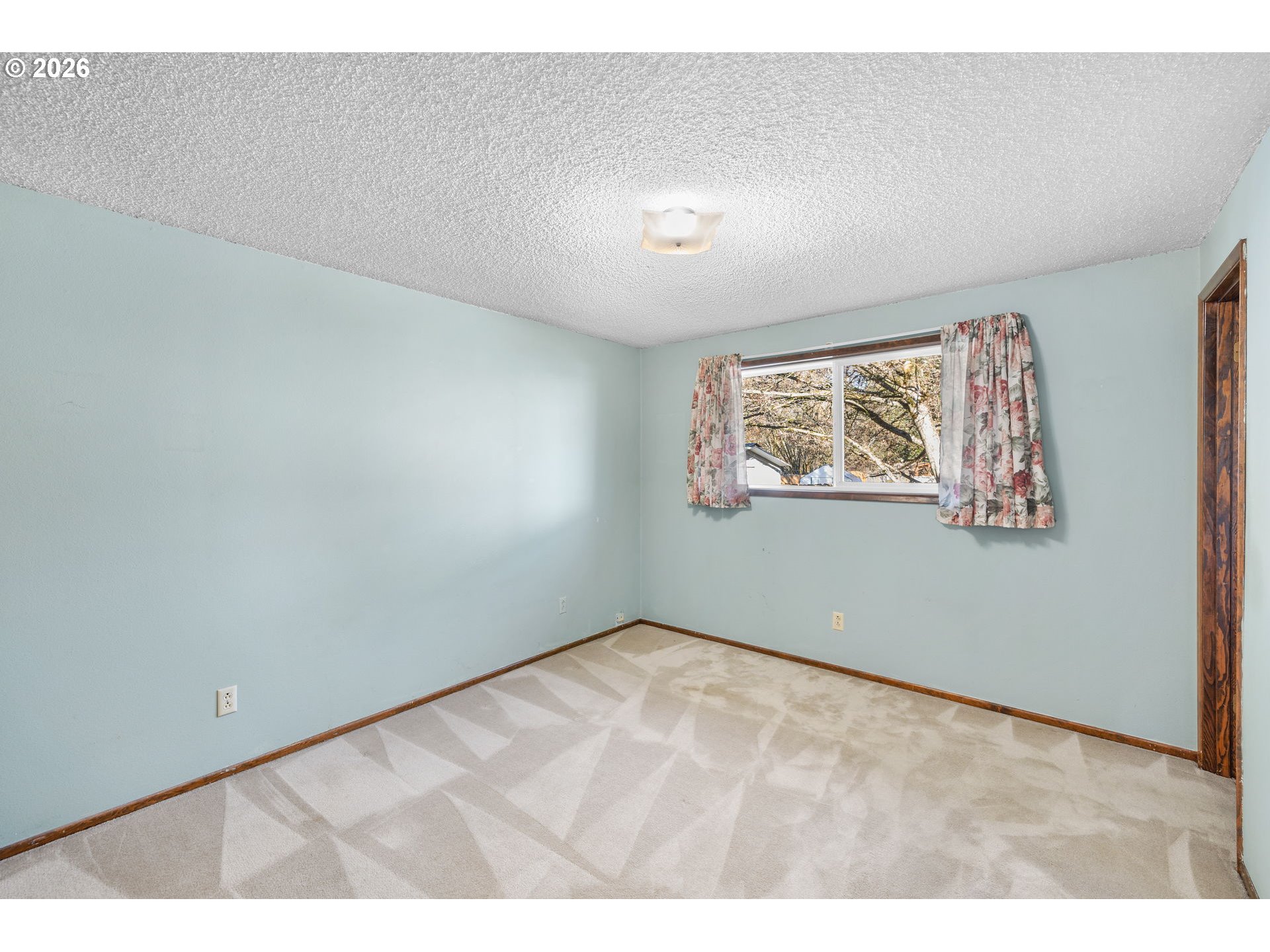 2216 Northeast 91st Street Vancouver, WA 98665 - Photo 21 of 30 an empty room with wooden floor and windows