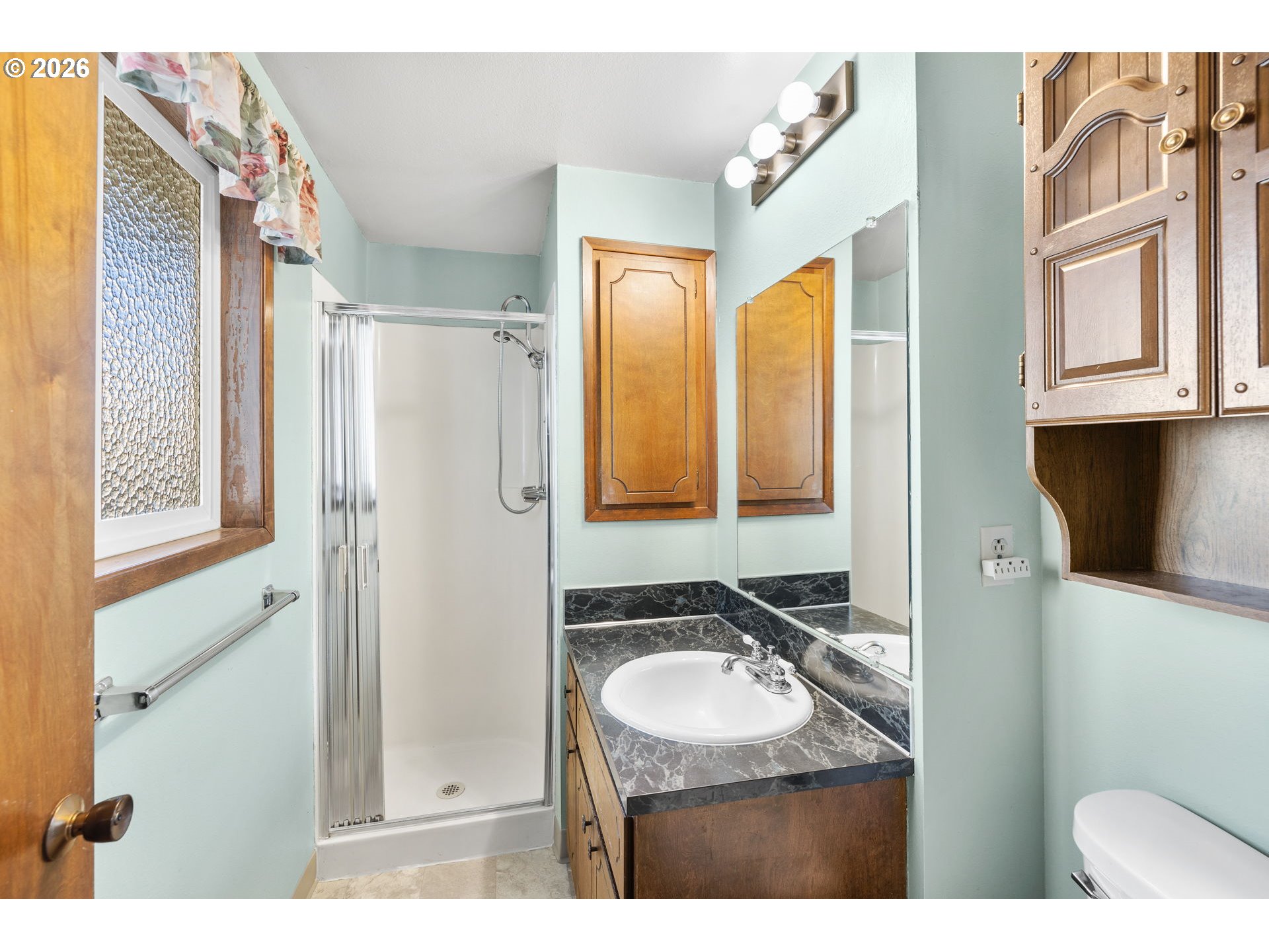 2216 Northeast 91st Street Vancouver, WA 98665 - Photo 23 of 30 a bathroom with a sink a toilet and a mirror