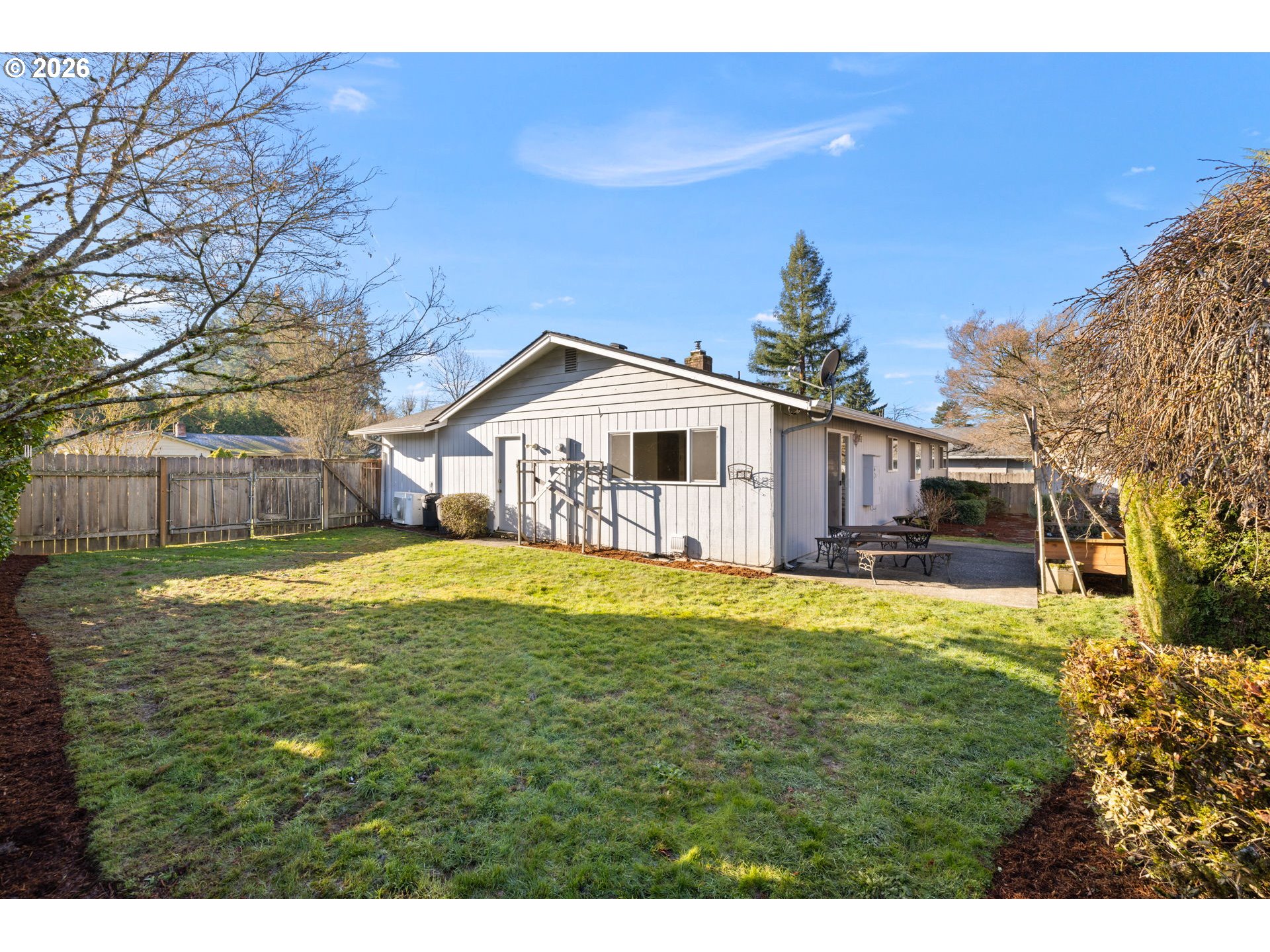2216 Northeast 91st Street Vancouver, WA 98665 - Photo 27 of 30 a swimming pool with yard and tree in the background