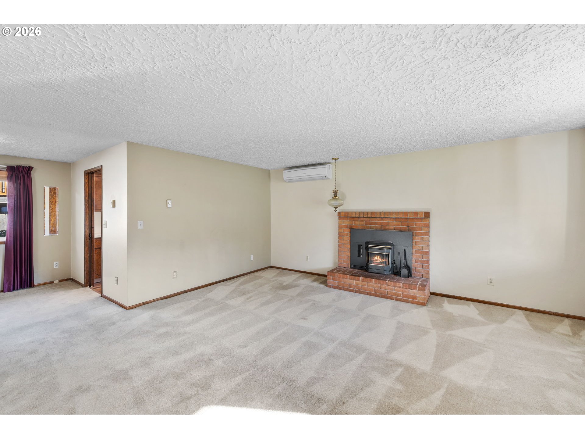 2216 Northeast 91st Street Vancouver, WA 98665 - Photo 6 of 30 a view of an empty room with a fireplace