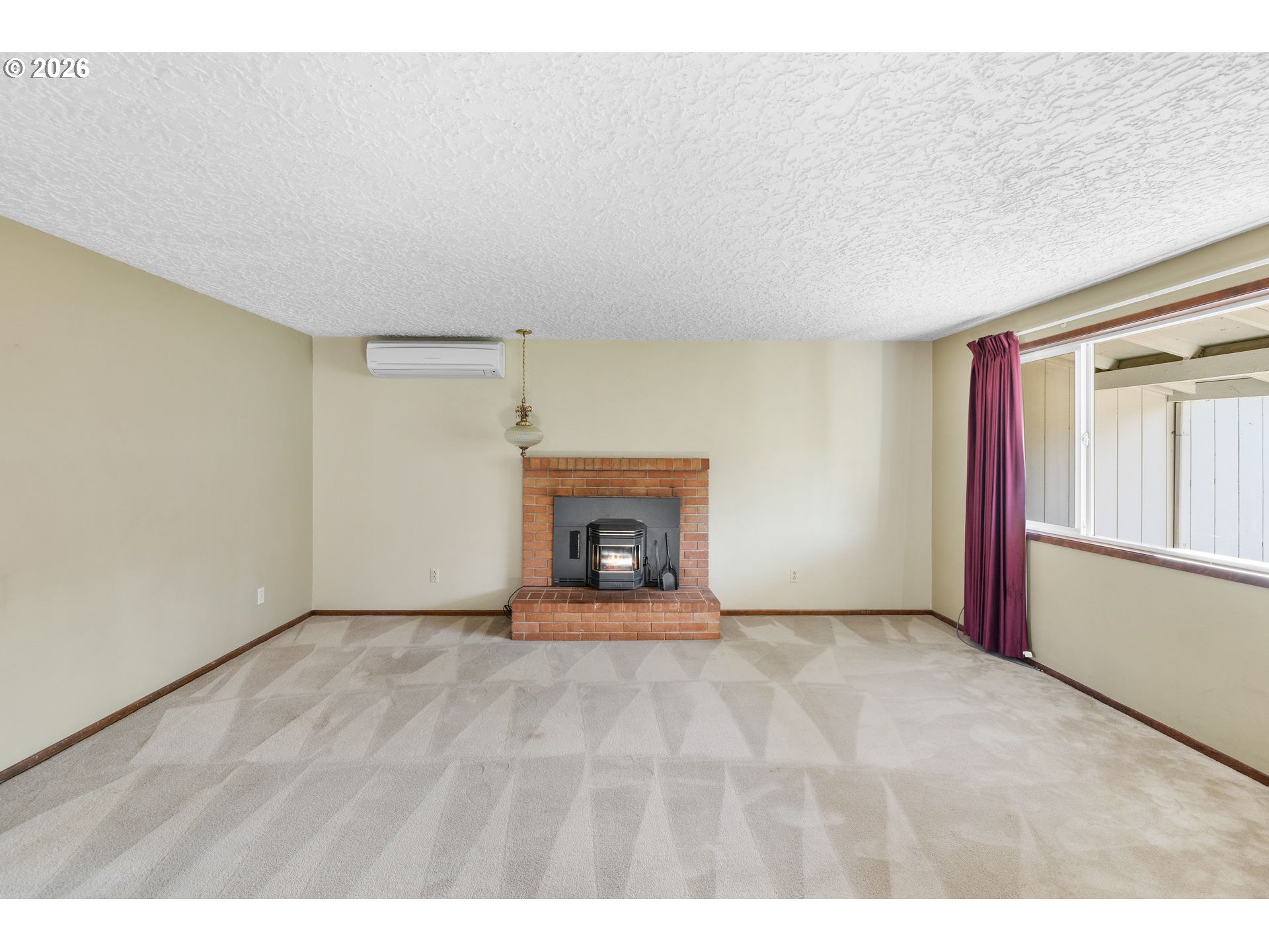 2216 Northeast 91st Street Vancouver, WA 98665 - Photo 7 of 30 a view of an empty room with a fireplace