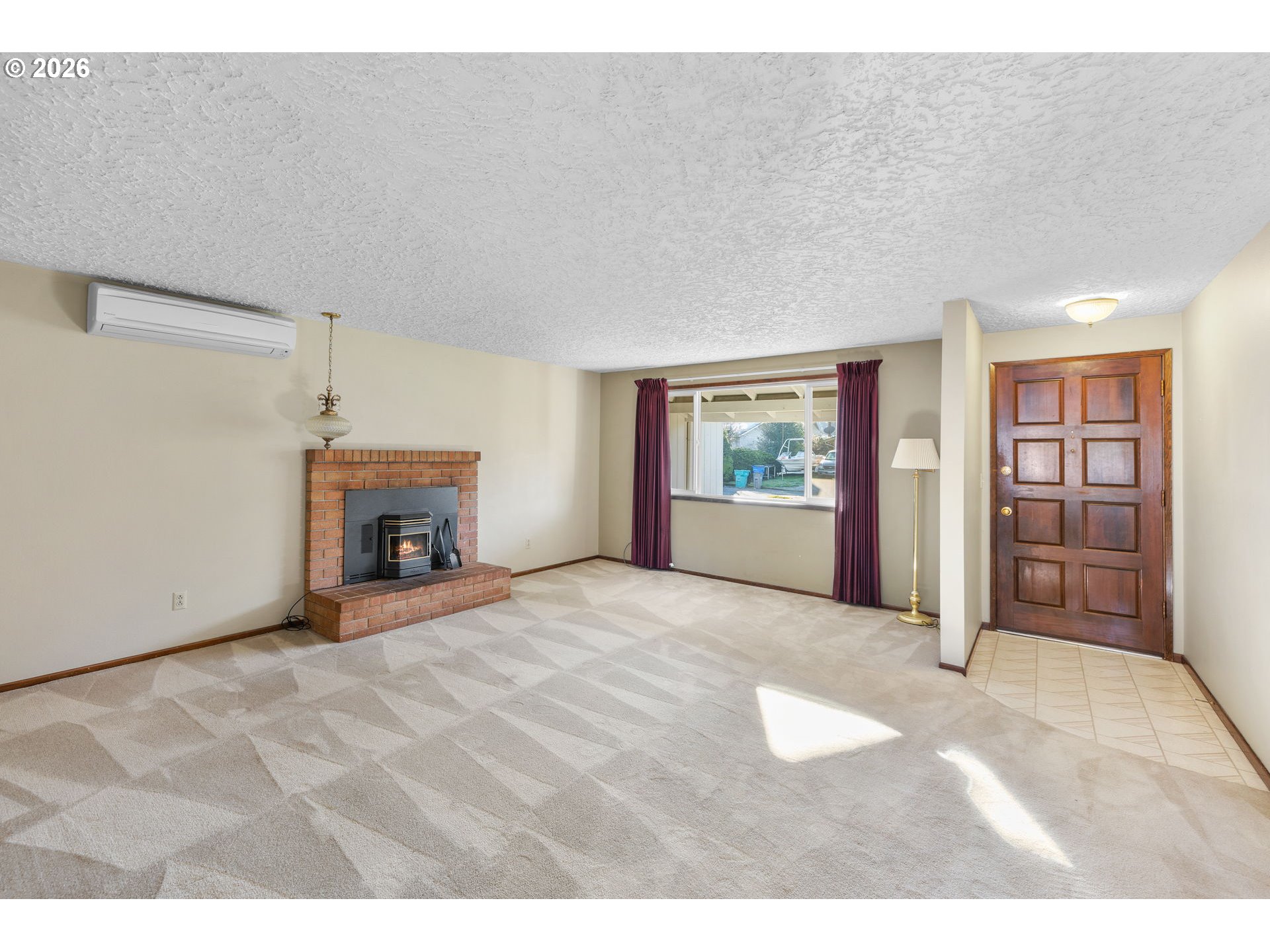 2216 Northeast 91st Street Vancouver, WA 98665 - Photo 8 of 30 a view of an empty room with a fireplace