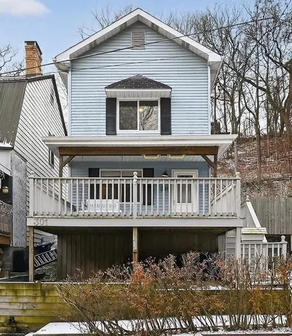 a front view of a house with a boat