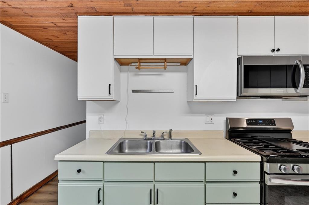 301 Milroy Street Pittsburgh, PA 15214 - Photo 13 of 24 a kitchen with a sink and cabinets