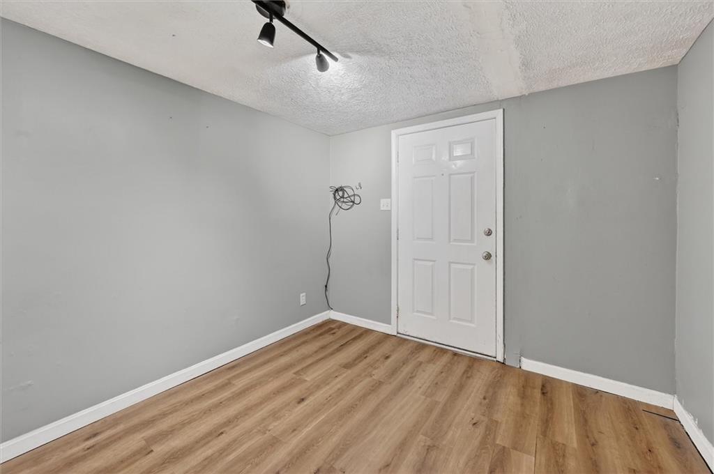 301 Milroy Street Pittsburgh, PA 15214 - Photo 15 of 24 a view of a room with wooden floor