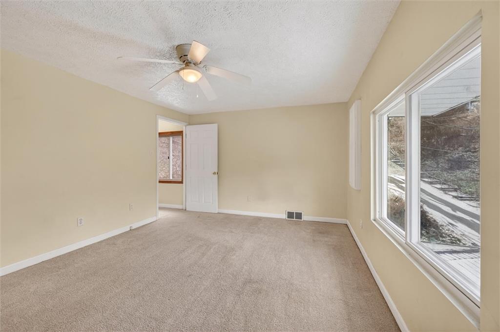 301 Milroy Street Pittsburgh, PA 15214 - Photo 17 of 24 a view of an empty room with a window