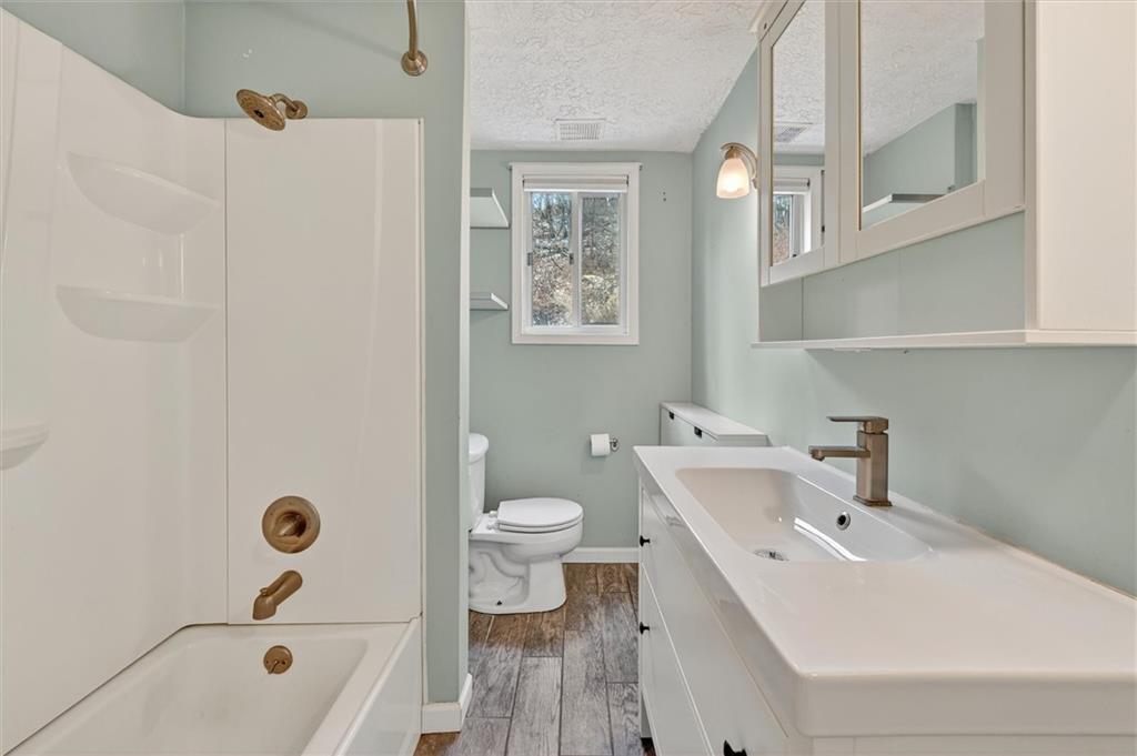 301 Milroy Street Pittsburgh, PA 15214 - Photo 18 of 24 a bathroom with a sink a toilet and shower