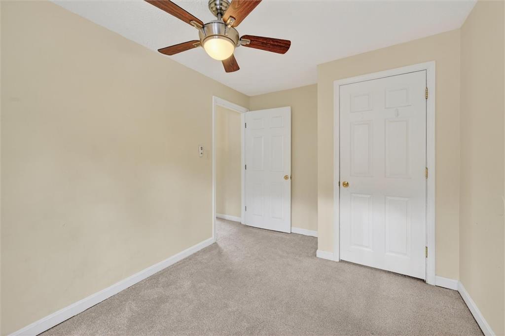 301 Milroy Street Pittsburgh, PA 15214 - Photo 20 of 24 an empty room with a ceiling fan and a fan