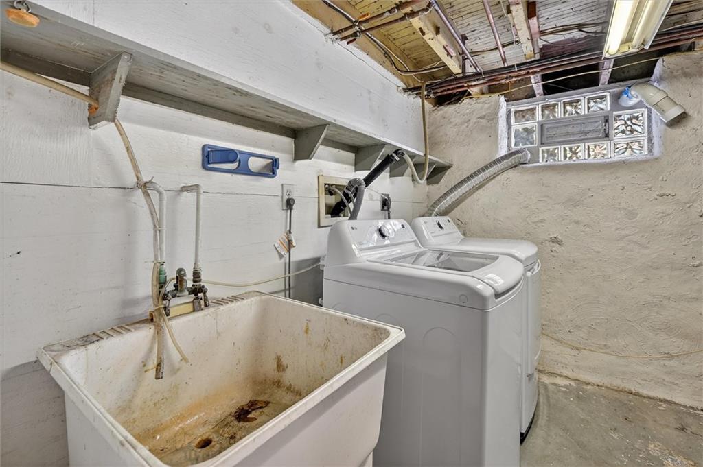 301 Milroy Street Pittsburgh, PA 15214 - Photo 22 of 24 a bathroom with a sink and mirror