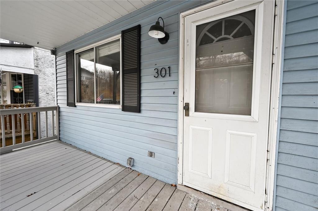 301 Milroy Street Pittsburgh, PA 15214 - Photo 4 of 24 a view of a balcony with furniture and wooden floor