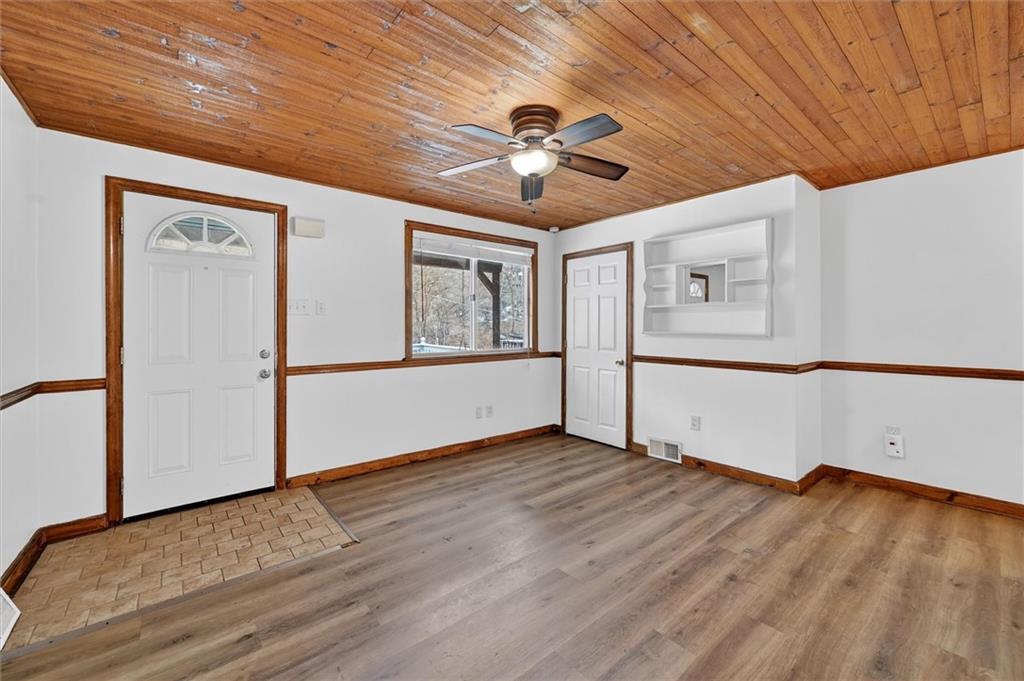 301 Milroy Street Pittsburgh, PA 15214 - Photo 7 of 24 a view of empty room with wooden floor and fan