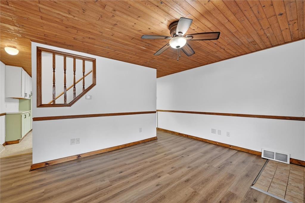 301 Milroy Street Pittsburgh, PA 15214 - Photo 8 of 24 a view of an empty room with wooden floor