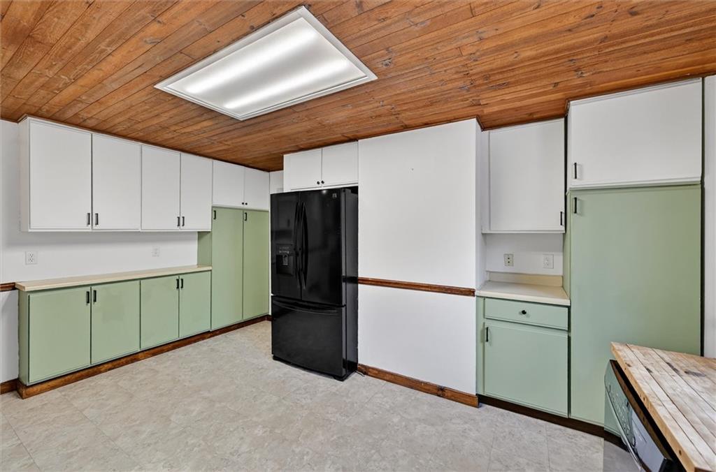 301 Milroy Street Pittsburgh, PA 15214 - Photo 9 of 24 a kitchen with a refrigerator and a sink