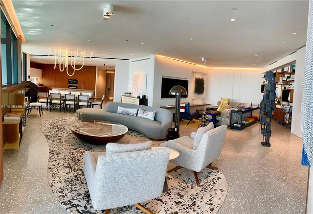 a living room with furniture and a table