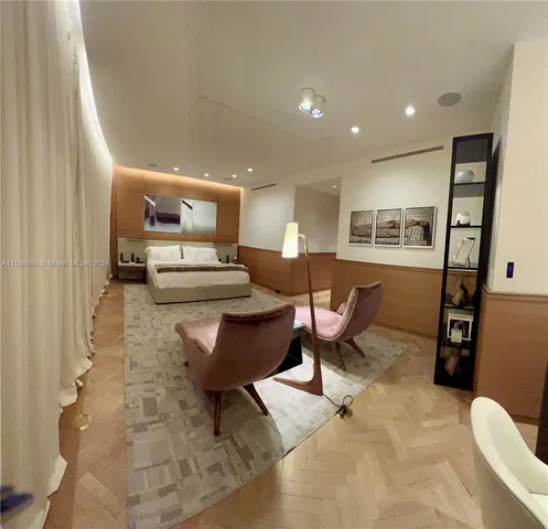 a bedroom with a bed and a couch