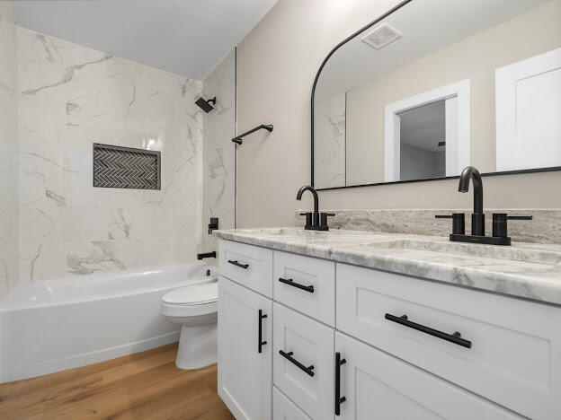6180 Old Hickory Road Crestview, FL 32539 - Photo 12 of 31 a bathroom with a granite countertop sink toilet and shower