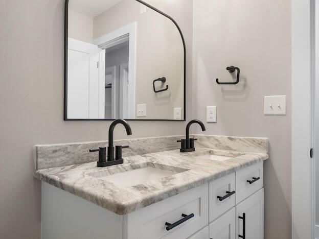 6180 Old Hickory Road Crestview, FL 32539 - Photo 13 of 31 a bathroom with a granite countertop sink and a mirror