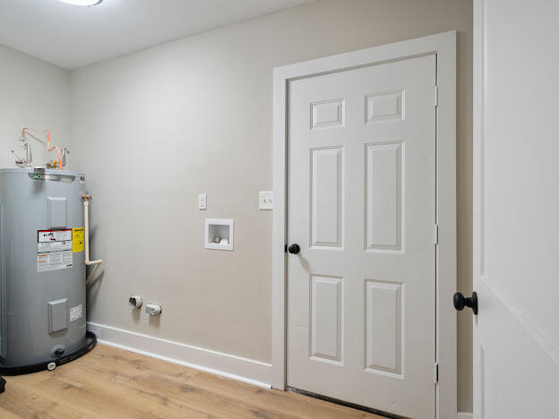 6180 Old Hickory Road Crestview, FL 32539 - Photo 20 of 31 an entryway with wooden floor and cabinet